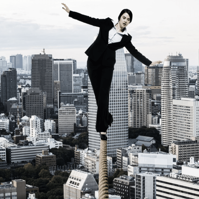 woman walking tightrope